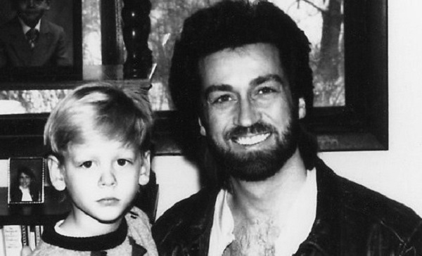 Lou Holly in the 1980s with his young son.